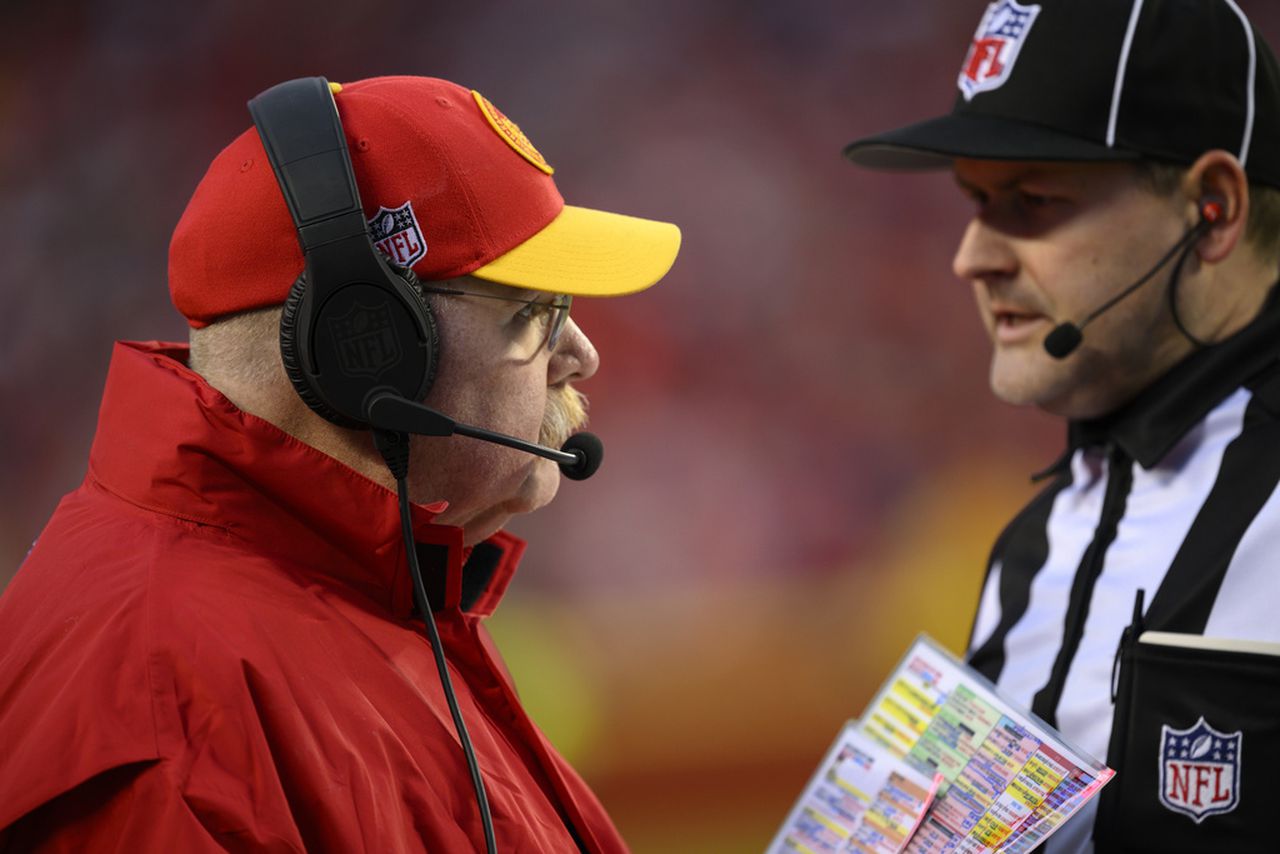 Kansas City coach Andy Reid talks with line judge Tom Eaton