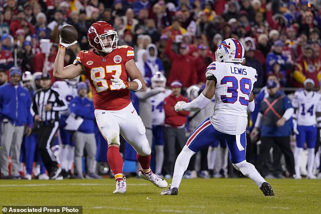 Kansas City Chiefs tight end Travis Kelce (87) laterals to teammate Kadarius Toney, not seen, as Buffalo Bills cornerback Cam Lewis (39) defends during the second half of an NFL football game Sunday, Dec. 10, 2023, in Kansas City, Mo. Toney ran the ball into the end zone, but the play was nullified by an offside penalty by Toney. (AP Photo/Ed Zurga)